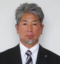 正面を向いて黒いスーツを着た土屋 学さんのプロフィールの写真